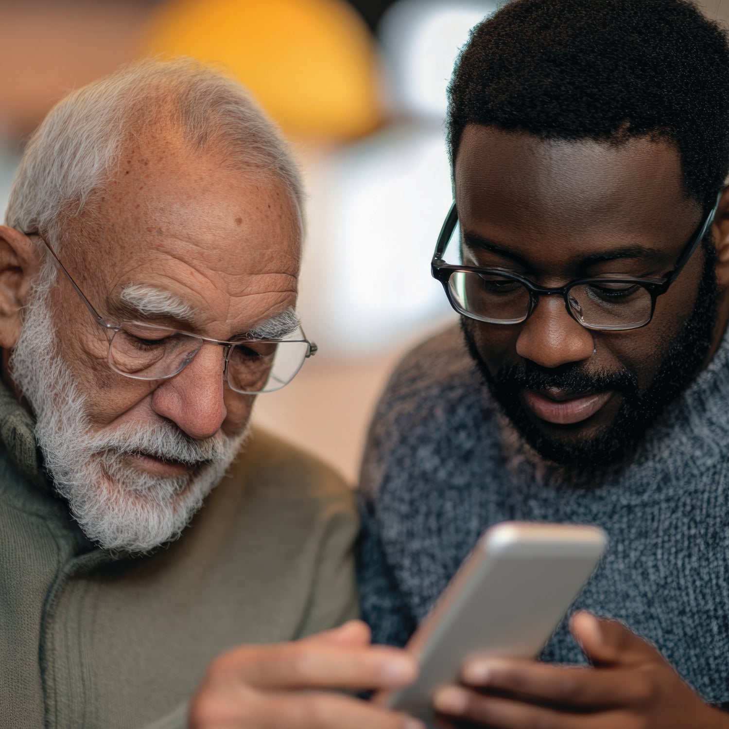 Older adult learning how to use an iPhone with one-to-one Apple device training and support.